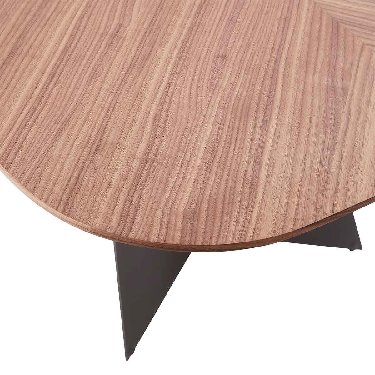 Stylish modern dining table with natural wood top and black geometric legs in a contemporary home with hardwood floors