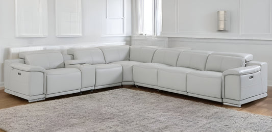 Modern white leather sectional reclining sofa with cup holders, perfect for contemporary living rooms and luxury interiors