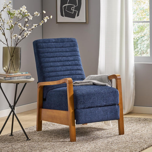 A side view of a mid-century modern pushback recliner in navy blue textured fabric. The chair features a clean-lined wood frame and a ribbed back, with a throw blanket draped over the seat.